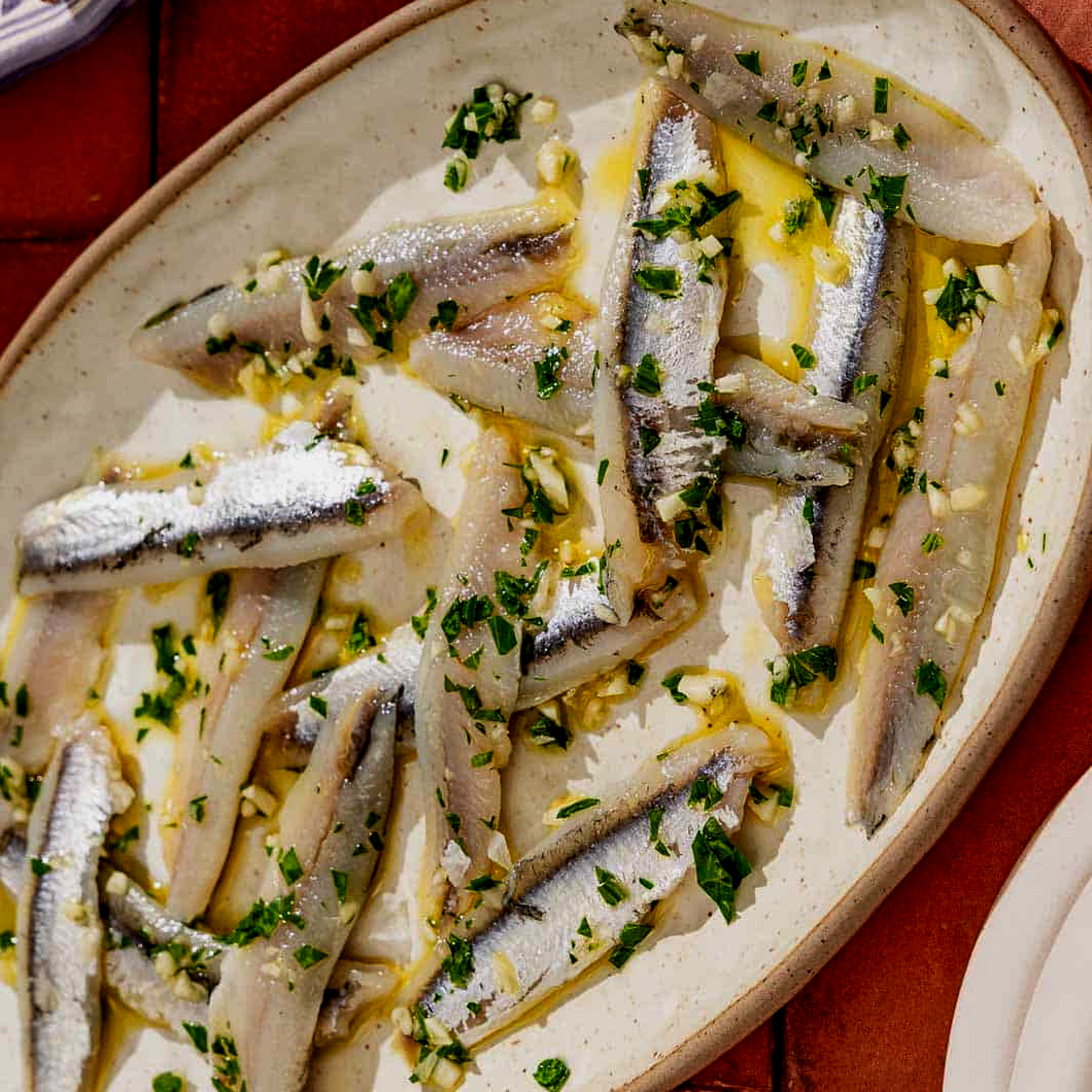 Spanish Boquerones marinated in vinegar, parsley, garlic
